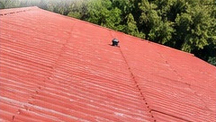 Before: weathered, faded roof
